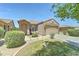 Charming single-Gathering home with a two-car garage, desert landscaping and front yard at 3128 W Belle Ave, San Tan Valley, AZ 85144