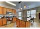 Eat-in kitchen featuring an island and stainless steel appliances at 3128 W Belle Ave, San Tan Valley, AZ 85144