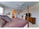 Spacious bedroom featuring a ceiling fan, a four poster bed, and ensuite bathroom access at 3128 W Belle Ave, San Tan Valley, AZ 85144