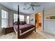 Serene main bedroom showcasing a four-poster bed and an ensuite bathroom at 3128 W Belle Ave, San Tan Valley, AZ 85144