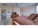 A comfortable bedroom featuring a ceiling fan, a four poster bed, and soft neutral carpeting at 3128 W Belle Ave, San Tan Valley, AZ 85144