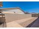 Private backyard area with gravel accents, a pathway, and a view of the surrounding fence at 3173 E Canyon Way, Chandler, AZ 85249