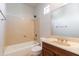 Bright bathroom with a bathtub, shower, vanity with sink, and a large mirror at 3173 E Canyon Way, Chandler, AZ 85249