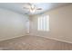 Bedroom with neutral carpeting, a closet, and a shuttered window at 3173 E Canyon Way, Chandler, AZ 85249