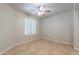 Clean bedroom with window, ceiling fan, and tile flooring at 3173 E Canyon Way, Chandler, AZ 85249