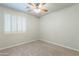 Bright bedroom with plush carpeting and white shuttered window at 3173 E Canyon Way, Chandler, AZ 85249