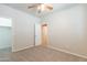 Bedroom featuring neutral carpeting, an open doorway, and a closet at 3173 E Canyon Way, Chandler, AZ 85249