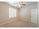 Inviting bedroom featuring neutral carpeting and a white shuttered window at 3173 E Canyon Way, Chandler, AZ 85249