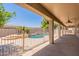 Covered patio view looking out to a backyard pool and desert landscaping at 3173 E Canyon Way, Chandler, AZ 85249