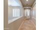 Inviting entryway with tiled floors, leading to a bright living space with plantation shutters at 3173 E Canyon Way, Chandler, AZ 85249