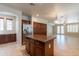 Open kitchen layout with stainless steel appliances, granite countertops, and central island at 3173 E Canyon Way, Chandler, AZ 85249