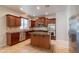 Well-appointed kitchen with stainless steel appliances and an island at 3173 E Canyon Way, Chandler, AZ 85249