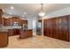 Gourmet kitchen features dark wood cabinetry and stainless steel appliances at 3173 E Canyon Way, Chandler, AZ 85249