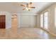 Large open living space with tile flooring, double doors, and access to other rooms in the home at 3173 E Canyon Way, Chandler, AZ 85249