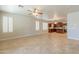 Spacious living room featuring tile floors and abundant natural light coming through the shuttered windows at 3173 E Canyon Way, Chandler, AZ 85249