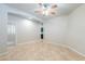 Spacious living room featuring tile floors, a ceiling fan, and neutral paint palette at 3173 E Canyon Way, Chandler, AZ 85249