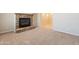 Relaxing living room with neutral carpet and a cozy stone fireplace at 3173 E Canyon Way, Chandler, AZ 85249