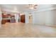 Expansive living space with kitchen, tile floors, and neutral color palette at 3173 E Canyon Way, Chandler, AZ 85249
