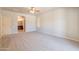 Spacious main bedroom with soft carpet, arched entry to the bathroom and view of the closet at 3173 E Canyon Way, Chandler, AZ 85249