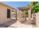View of outdoor kitchen with barbecue, stone accents and gated access to pool area at 3173 E Canyon Way, Chandler, AZ 85249
