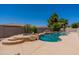 Backyard swimming pool and jacuzzi surrounded by well-maintained landscaping at 3173 E Canyon Way, Chandler, AZ 85249