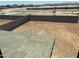 View of the backyard of a new construction house surrounded by block fencing at 31774 N Bandit Rd, San Tan Valley, AZ 85143