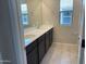 Bathroom featuring dual sinks, a vanity, and a large mirror at 31774 N Bandit Rd, San Tan Valley, AZ 85143
