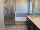 Bathroom featuring a separate shower and tub, vanity with a sink, and ceramic tile at 31774 N Bandit Rd, San Tan Valley, AZ 85143