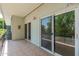 Balcony features textured railings, outdoor lighting, and sliding glass doors to the home's interior at 330 W Maryland Ave # 207, Phoenix, AZ 85013