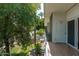 A view from the balcony showcasing lush landscaping and a serene neighborhood setting at 330 W Maryland Ave # 207, Phoenix, AZ 85013