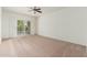 Bright and airy bedroom with sliding glass door to balcony and neutral carpet at 330 W Maryland Ave # 207, Phoenix, AZ 85013