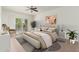 Bright bedroom with balcony access featuring an inviting bed, lamps, and plants at 330 W Maryland Ave # 207, Phoenix, AZ 85013