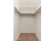 A simple empty closet with carpet and some shelving is ready to be organized at 330 W Maryland Ave # 207, Phoenix, AZ 85013