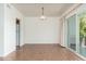 Bright dining room featuring tile flooring and sliding glass doors to outdoor patio at 330 W Maryland Ave # 207, Phoenix, AZ 85013