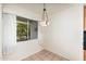The dining area features a hanging light fixture and a view of the outdoors at 330 W Maryland Ave # 207, Phoenix, AZ 85013