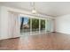 Bright dining room featuring tile flooring and large sliding glass doors to the patio at 330 W Maryland Ave # 207, Phoenix, AZ 85013