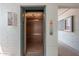 A clean elevator with wood-grain paneling and soft lighting awaits passengers in this building at 330 W Maryland Ave # 207, Phoenix, AZ 85013