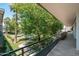 Balcony view overlooking community pool, mature trees and beautiful landscaping at 330 W Maryland Ave # 207, Phoenix, AZ 85013