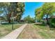 Beautifully maintained grounds with mature trees and manicured lawns create a park-like setting at 330 W Maryland Ave # 207, Phoenix, AZ 85013