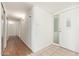 A clean hallway and front entrance, with tiled flooring and a decorative glass front door at 330 W Maryland Ave # 207, Phoenix, AZ 85013