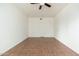 Bright living room features tile floors, ceiling fan, neutral paint, and a closet at 330 W Maryland Ave # 207, Phoenix, AZ 85013