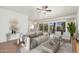 Living room featuring tile floors, balcony access, and neutral decor for a modern look at 330 W Maryland Ave # 207, Phoenix, AZ 85013