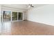 Bright living room featuring tile floors and a large sliding glass door leading to a balcony at 330 W Maryland Ave # 207, Phoenix, AZ 85013