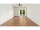 Bright living room features tile floors, ceiling fan, and a sliding door to the outside balcony at 330 W Maryland Ave # 207, Phoenix, AZ 85013