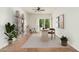 Bright living room features tile floors, ceiling fan, a sliding door and tastefully decorated office space at 330 W Maryland Ave # 207, Phoenix, AZ 85013