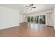 Spacious living area with tiled floors and expansive sliding doors to the outside balcony at 330 W Maryland Ave # 207, Phoenix, AZ 85013