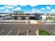 Community clubhouse featuring a pool and ample parking for residents and guests at 3853 S Buttercup Cir, Mesa, AZ 85212