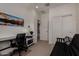 Functional bedroom featuring a sleek desk setup, decorative artwork, and convenient closet access at 4548 S Renaissance Dr # 103, Gilbert, AZ 85297