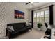 Inviting bedroom with polka dot wallpaper, futon sofa, and a well-lit desk area, perfect for relaxing at 4548 S Renaissance Dr # 103, Gilbert, AZ 85297