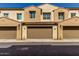 Attractive townhome showcases well-maintained stucco, tile roof, and private two car garage at 4548 S Renaissance Dr # 103, Gilbert, AZ 85297